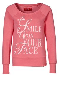 Roze sweatshirt met lange raglanmouwen, ronde hals en een afdruk van witte tekst met de tekst "EEN LAK MOOT JOUW GEZICHT." Zachte textuur.