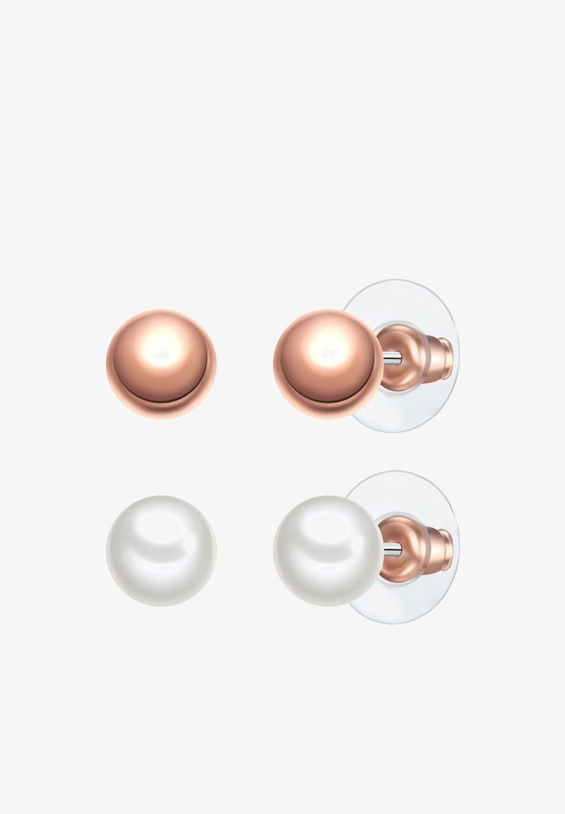 Dos pomos de puerta: uno de color cobre, redondo y con acabado brillante, y uno blanco, esférico también brillante, ambos montados en placas traseras transparentes.