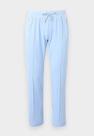 Light blue jogger pants made of soft fabric with elastic waistband, drawstring, and side pockets; features discreet stitching details.