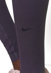 Nike Performance W NK ALL-IN LUX TGHT - Leggings - dark raisin