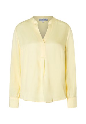 Gelbe Langarmbluse mit Stehkragen, teilweise mit Knopfleiste und lockerem Schnitt. Hergestellt aus leichtem Stoff.