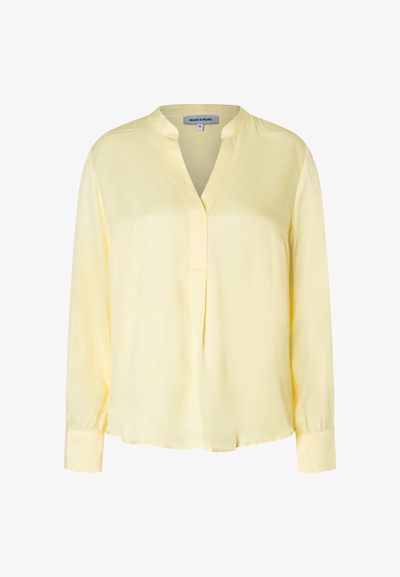 Geel overhemd met lange mouwen en een mandarin kraag, voorzien van een gedeeltelijke knoopsluiting en een losse pasvorm. Gemaakt van lichtgewicht stof.