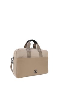 Beige läppäriväskä, jossa on vetoketju, kangasvastukset, tekstuuri pohja ja logo edessä. Varustettu säädettävällä olkahihnalla.