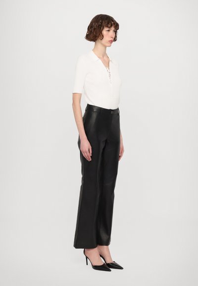 STUDIO ID DANA  - Leather trousers - black
