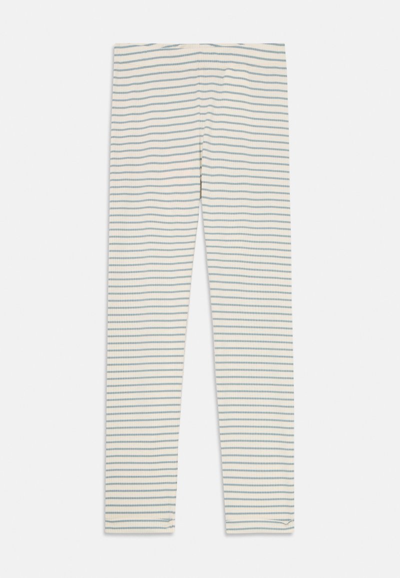 Leggings côtelés couleur crème avec de fines rayures horizontales bleues, posées à plat sur un fond blanc.