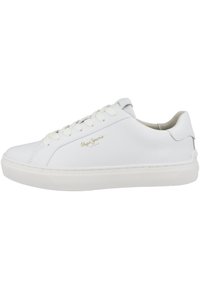 White sneaker with a smooth texture, featuring flat laces, a rounded toe, and subtle branding in gold. Rubber sole with patterned grip.