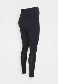 Leggings pretos com uma textura suave e um design ajustado ao corpo. Apresentam uma cintura alta e um corte até ao tornozelo para uma aparência elegante.