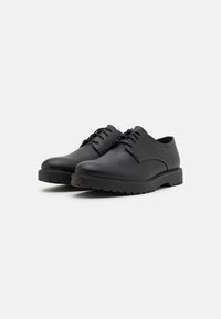 Black leather lace-up shoes with a rounded toe, smooth texture, rubber outsole, and minimal stitching details, featuring flat laces.