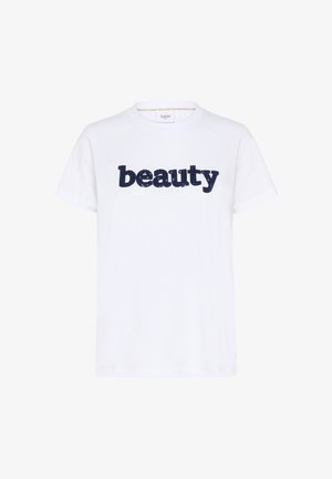 Fehér, rövid ujjú, pamut póló, amelyen a "szépség" szó sötétkék flitterekből készült a mellkasán. Egyszerű kerek nyakkivágás.