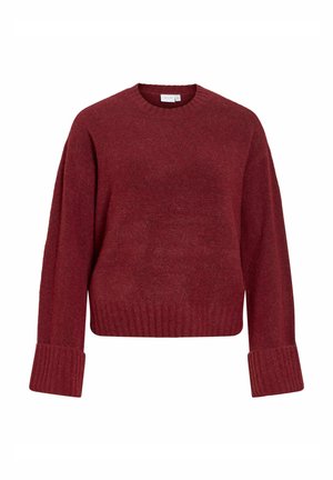 Rød strikket sweater med lange ærmer, ribbede manchetter og kant. Blød tekstur med en afslappet pasform og klassisk rund halsudskæring.