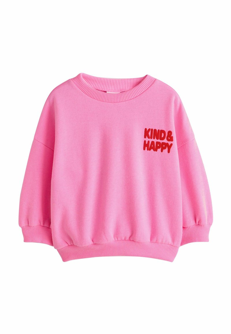 Rosa Sweatshirt mit rundem Ausschnitt, fallenden Schultern, gerippten Bündchen und Saum. Rote "KIND & HAPPY"-Aufschrift auf der linken Seite. Weicher Stoff.
