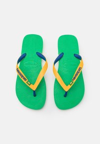Green rubber flip-flops with yellow and blue straps. Features textured footbed and logo detailing on one strap. Classic thong design.