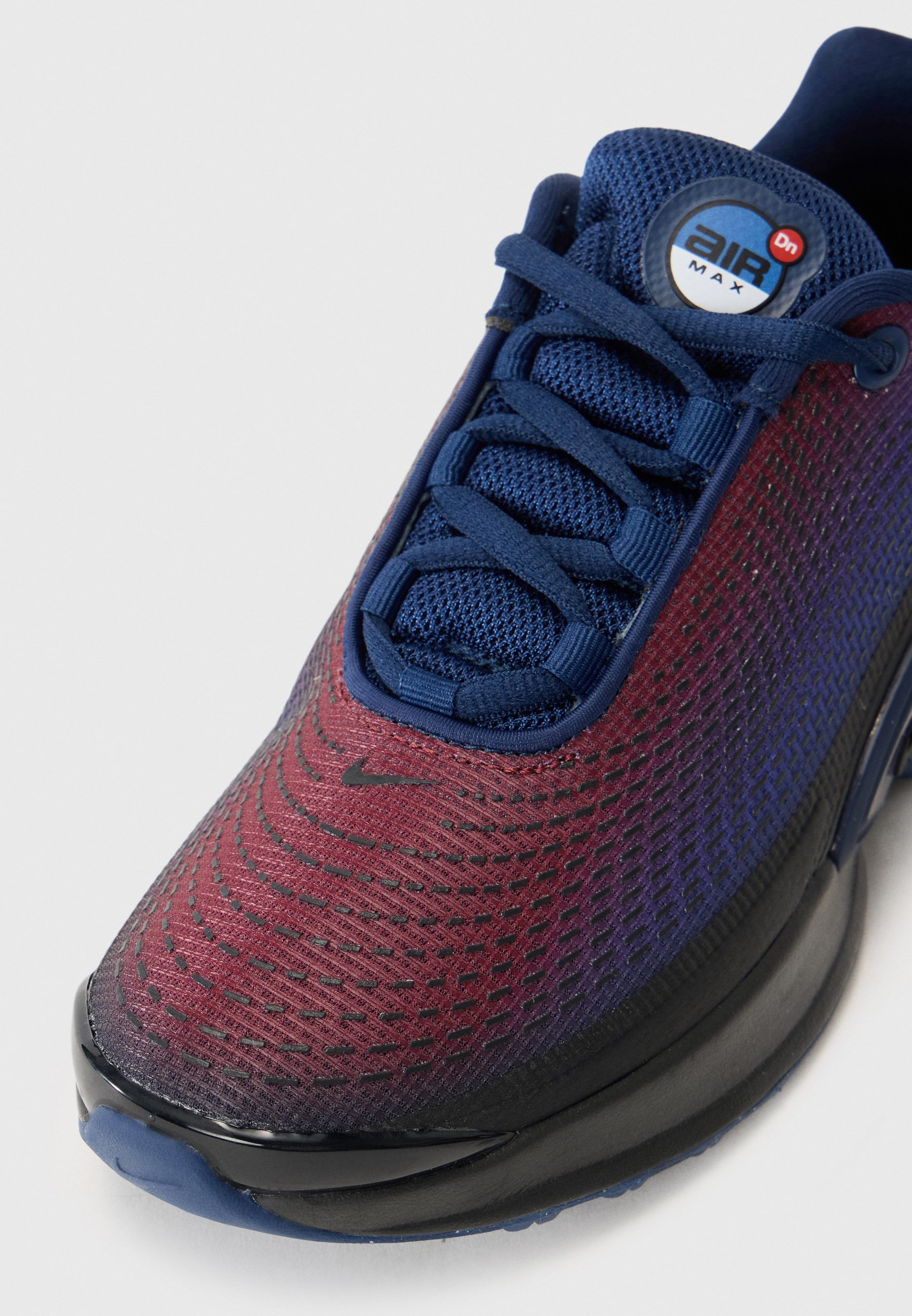 navy blue and red nike shoes
