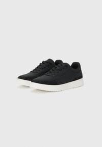 Black athletic shoes with a smooth upper texture, lace-up design, and a white rubber sole. Featuring contrasting stitching and a streamlined shape.