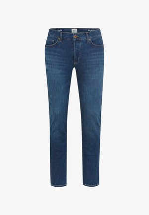 Blå slim-fit jeans med fem lommer, knaplukning og subtil falmning på lår og knæ, vist på en hvid baggrund.