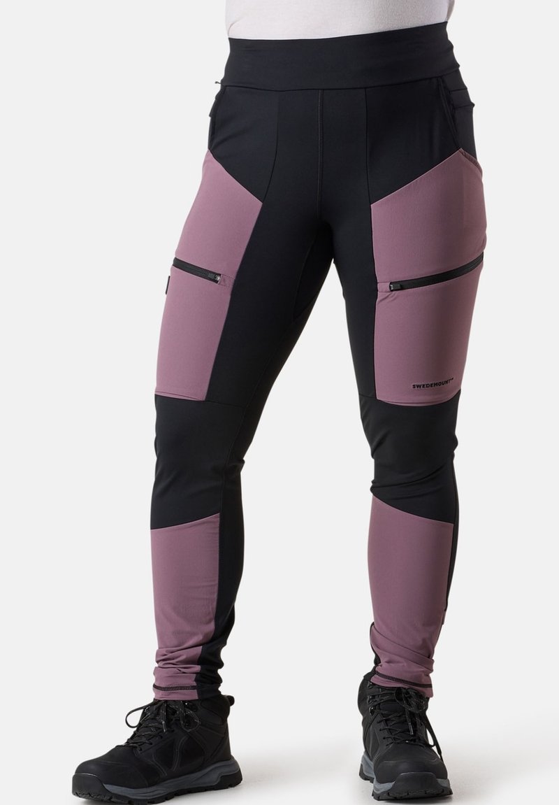 Svarta och mauve träningsbyxor med hög midja, dragkedjefickor och en figurnära design. Tillverkade av elastiskt, strukturerat material.