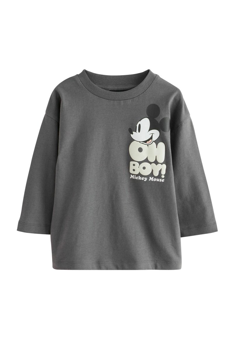 Tmavohnedé bavlnené tričko s veľkým potlačeným grafickým motívom Mickey Mouse a frázou "OH BOY!" v bielej a žltej farbe. Okrúhly výstrih, dlhé rukávy.