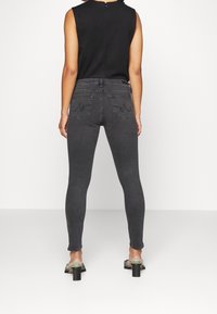 AG Jeans Vaqueros pitillo - black