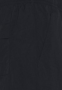 Nike SB NOVELTY TRACK PANT UNISEX - Calças de fato de treino - black