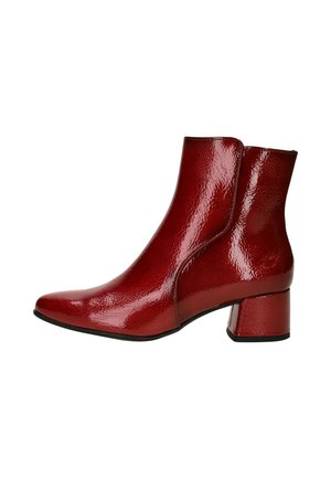Red patent leather ankle boots with a pointed toe and block heel. Smooth texture and sleek design, featuring side panels and a shiny finish.