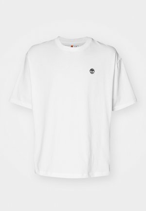 White cotton t-shirt with a round neckline, short sleeves, and a small black tree logo on the left chest. Soft fabric, relaxed fit.