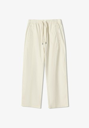 Krémové, lehké kalhoty s širokými nohavicemi, elastickým pasem, nastavovací šňůrkou a dvěma bočními kapsami. Texturovaná látka.