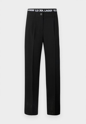 Pantalones negros confeccionados en una mezcla de algodón. Presentan una cinturilla blanca con marca, cierre de botón y un diseño recto con bolsillos laterales.