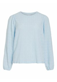 Lyseblå bluse med lange ermer laget av teksturert stoff med blomster-øyehulldesign, rund hals og rynkede mansjetter. Avslappet passform.