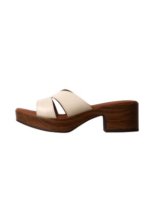 Sandalo scivolo beige in pelle con punta aperta, cinturini incrociati e tacco a blocco in legno marrone con suola platform.