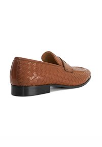 Brown leather loafers with woven texture, flat black sole, and slight heel, featuring a rounded toe and minimal stitching detail.