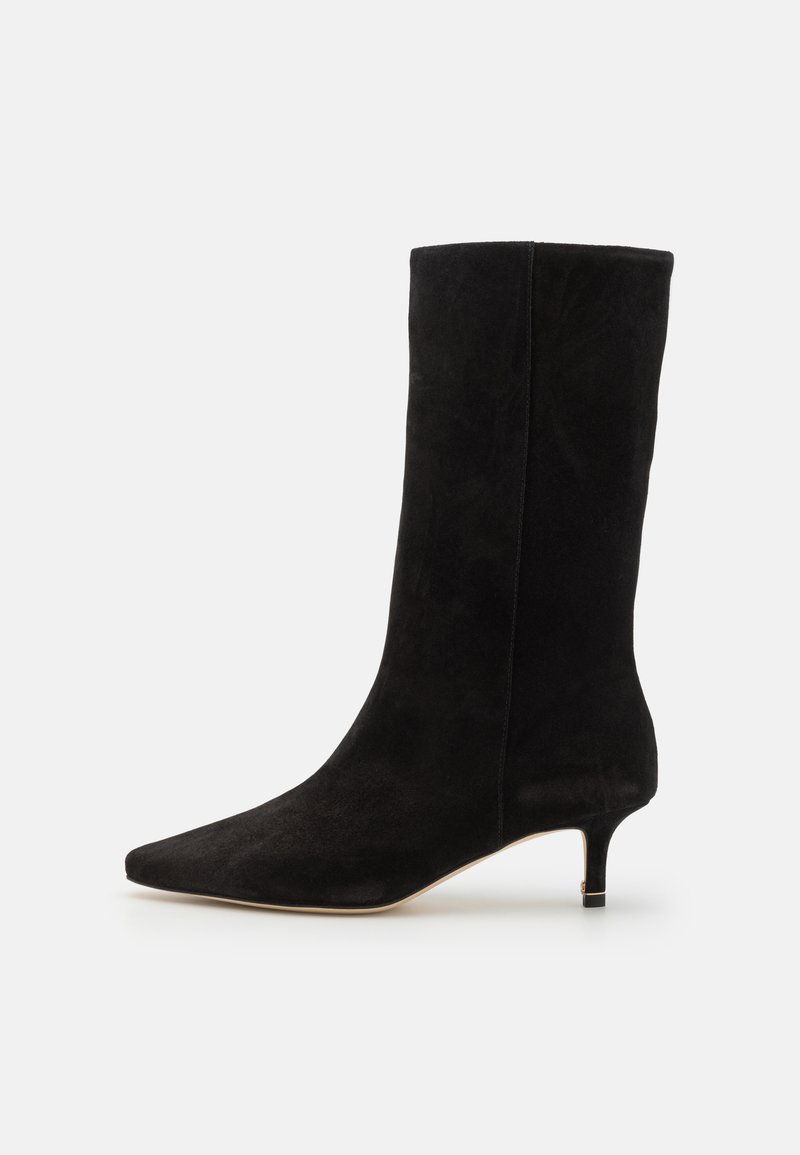 Black suede ankle boot with a pointed toe and a thin, short heel. The design features a smooth texture and a fitted silhouette.