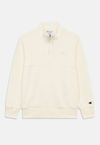 Ανοιχτόχρωμο μπεζ φούτερ Champion με φερμουάρ μέχρι τη μέση, γιακά σε όρθια μορφή, μακριά μανίκια, ριμπ μανσέτες και τελείωμα, και μικρό λογότυπο στο στήθος και στο μανίκι.