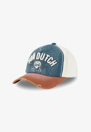Une casquette avec un dessus en denim bleu, des côtés crème et une visière usée en marron. Présente une broderie "VON DUTCH" et un motif de skull.