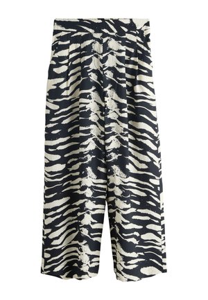 Bukser med vide ben med sort-hvidt abstrakt zebra-stribet mønster og elastisk talje.