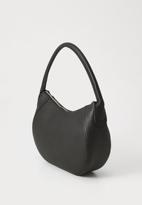 Black leather handbag with a curved design, smooth texture, and short handle. Features a gold zipper and minimalist accents.
