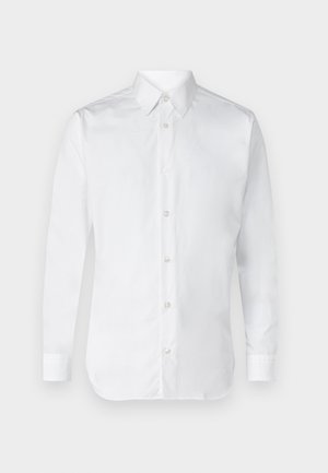 Bela srajca z dolgimi rokavi, iz gladkega bombažnega materiala, s klasičnim ovratnikom in subtilnim sijajem. Pet gumbov spredaj.