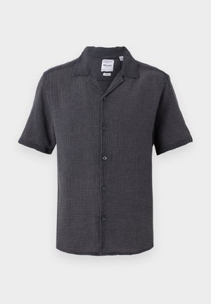 Chemise boutonnée à manches courtes gris foncé en tissu texturé. Dotée d'un col et de cinq boutons à l'avant.