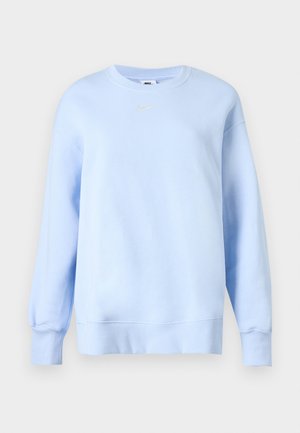 Svijetloplava Nike majica s okruglim izrezom, dugim rukavima, rebrastim manžetama i rubom, te malim bijelim Nike Swoosh logom na prsima.