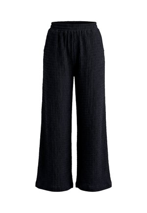 Zwarte wijde broek met gestructureerde stof en elastische tailleband, weergegeven tegen een witte achtergrond.