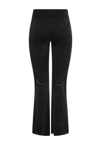 Pantaloni in velluto nero a vita alta con gambe svasate e cintura elastica, mostrati da dietro su sfondo bianco.