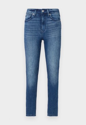 Skinny jeans i denim i medelblått med en något blekt utseende. Har en femficksdesign, bältesloopar och dragkedja.
