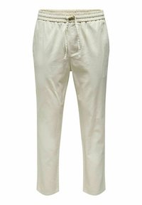 Beige Baumwollhose mit elastischem Bund und verstellbarem Kordelzug, gerade geschnitten, vor einem weißen Hintergrund gezeigt.