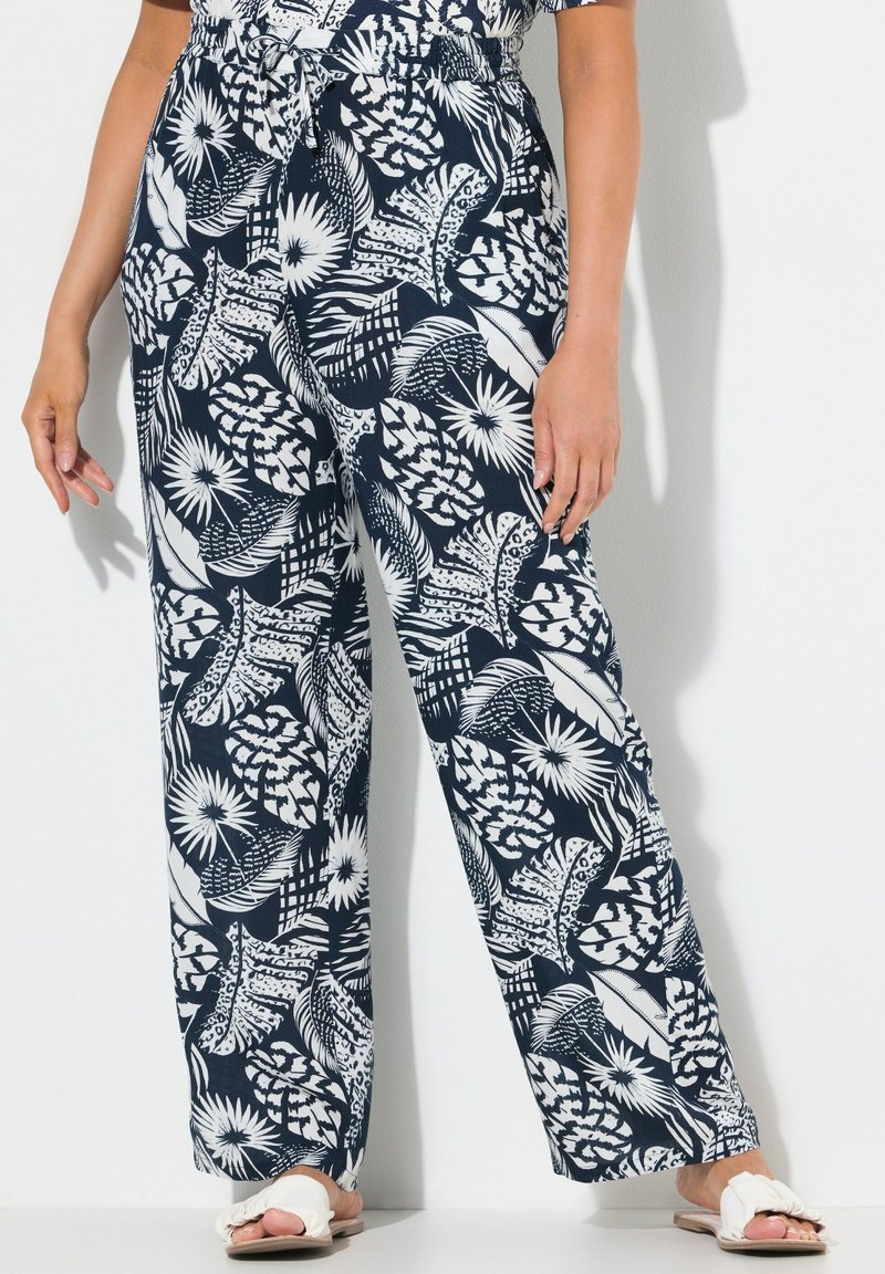 Pantalons à motifs feuillage bleu marine et blanc, dotés d'une taille élastique avec cordon de serrage et d'une coupe ample. Fabriqués en tissu léger.