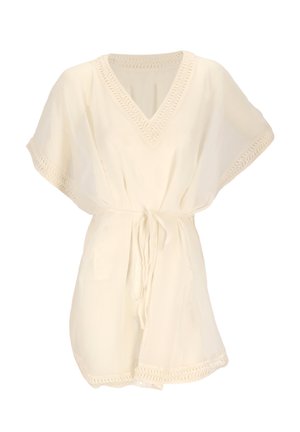 Robe courte à manches courtes de couleur crème avec col en V, bordure en crochet et ceinture en tissu nouée à la taille.
