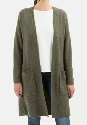 Olive green long cardigan made of soft knit material, featuring two front pockets and ribbed cuffs for added texture and comfort.