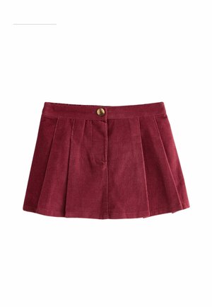 Mini-jupe en velours côtelé rouge vin avec plis sur le devant et un seul bouton doré à la taille.