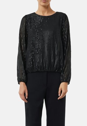 Blusa nera a maniche lunghe con righe testurizzate e accenti metallici. La vestibilità è rilassata, con orlo e polsini arricciati. Tessuto leggero e trasparente.
