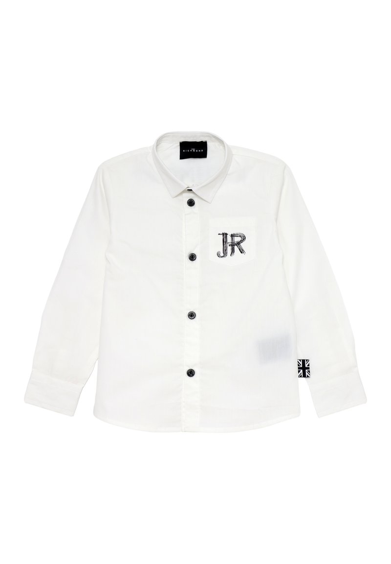 Camicia bianca a maniche lunghe con colletto, bottoni neri, tasca con ricamo "JR" e una decorazione a forma di bandiera sul manica.