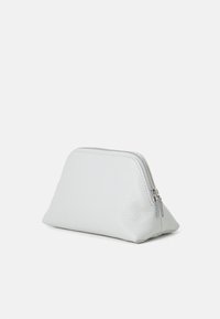 White textured leather pouch with a triangular shape, zip closure on top, and subtle stitching detail along the edges.