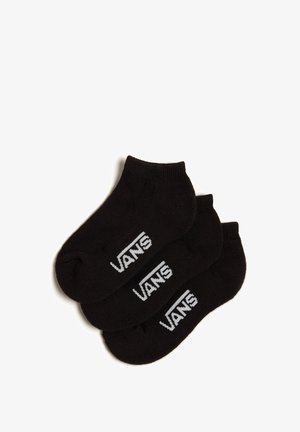 Calcetines negros hasta el tobillo hechos de una mezcla de algodón, con un logo blanco de "VANS" en el costado. Tres pares apilados juntos.